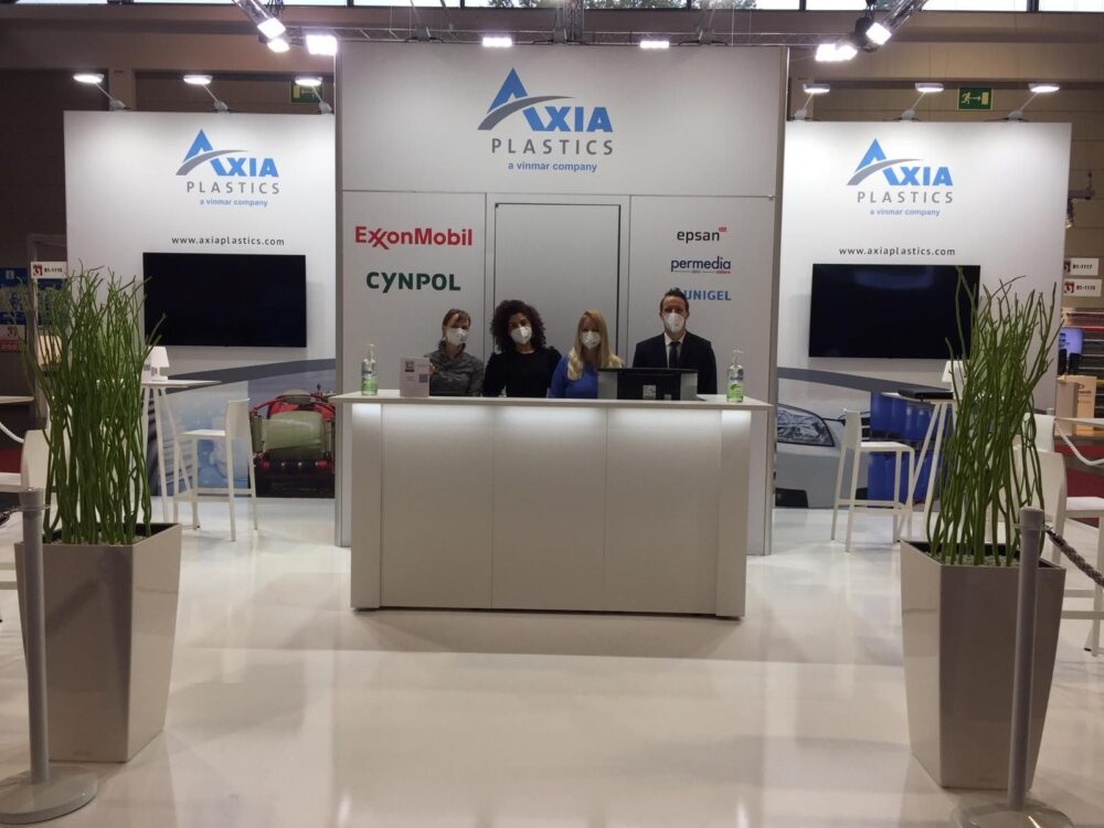 Tribe Design creates custom booth design for Axia Plastics. Tribe